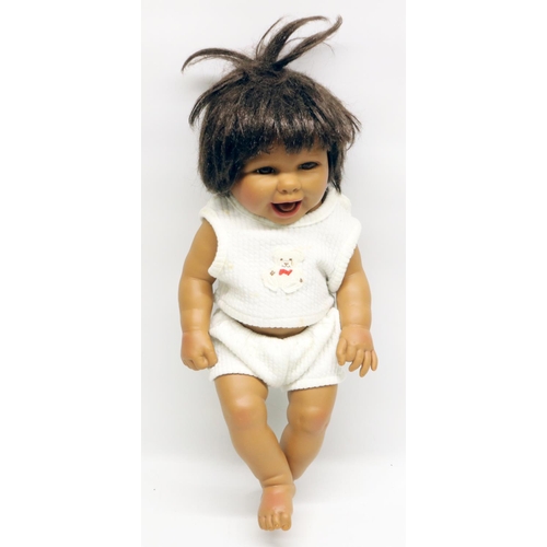 125 - Unmarked vinyl baby doll, H43cm