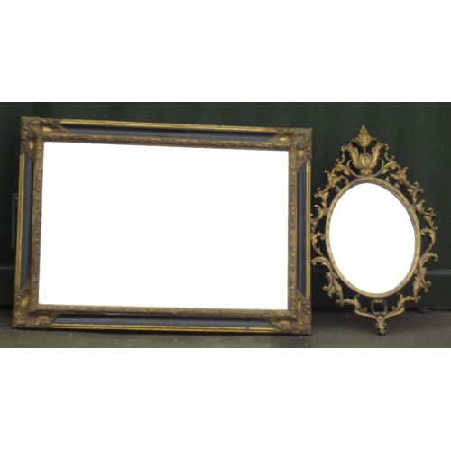 381 - Regency style black and gilt finished wall mirror, W108cm H78cm and a n oval wall mirror in pierced ... 