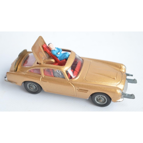 489 - Corgi James Bond gold painted Aston Martin DB5 (261) with original box, insert, spare ejecting figur... 