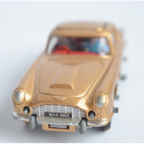 489 - Corgi James Bond gold painted Aston Martin DB5 (261) with original box, insert, spare ejecting figur... 