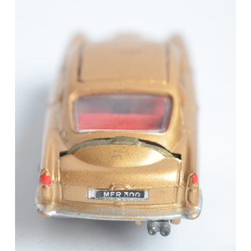 489 - Corgi James Bond gold painted Aston Martin DB5 (261) with original box, insert, spare ejecting figur... 