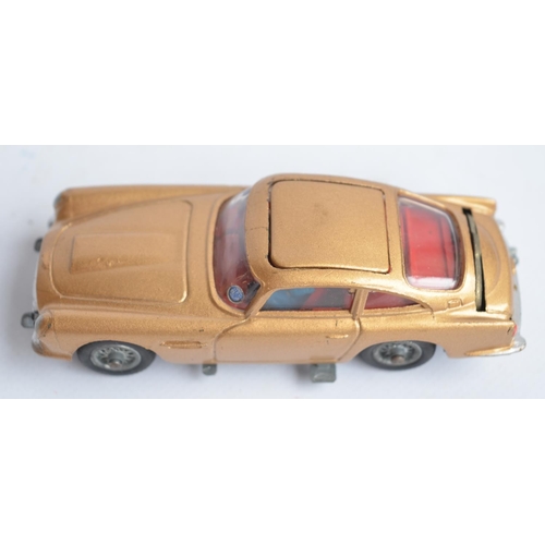 489 - Corgi James Bond gold painted Aston Martin DB5 (261) with original box, insert, spare ejecting figur... 