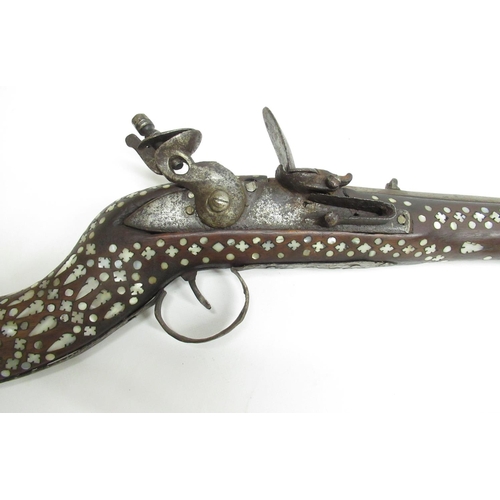 51 - Indo-Persian style flintlock musket with copper barrel rings, inlaid with mother of pearl throughout... 