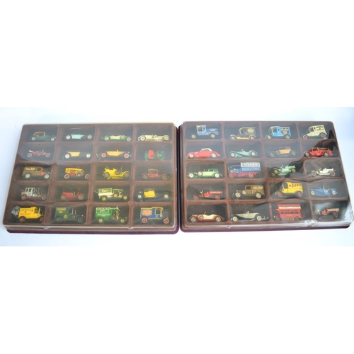 508 - Two wall mounting plastic display cases with clear plastic viewing panes containing 40 Matchbox Mode... 