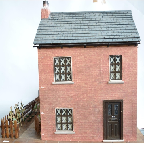 513 - Large charming home made wooden wartime house model with Anderson shelter. Includes removeable panel... 