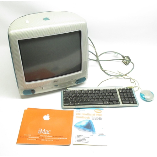 73 - Apple iMac Personal computer featuring CD tray, with keyboard, mouse, and power supply, user guide, ... 