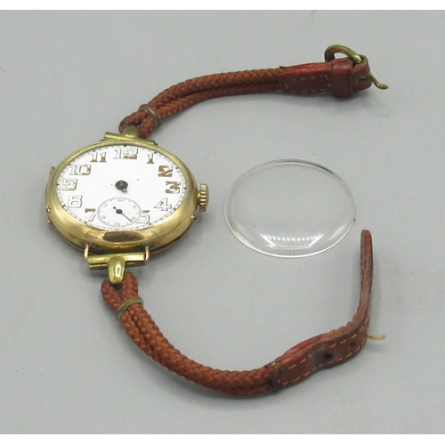 153 - Swiss - gold trench wristwatch, white enamel Arabic dial with skeletonised numerals and subsidiary s... 