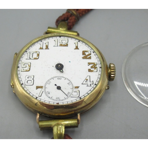 153 - Swiss - gold trench wristwatch, white enamel Arabic dial with skeletonised numerals and subsidiary s... 