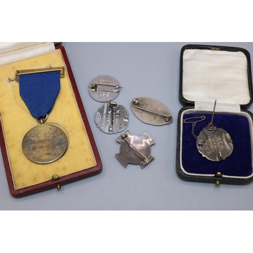 173 - Group of c1930s-1950s nursing badges and medals, incl. cased a silver and enamel Royal Manchester Ch... 