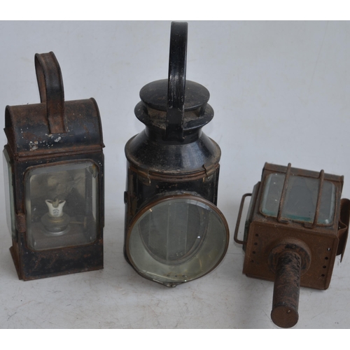 624 - Two vintage railway lamps to include a BR(M) railwayman's lamp with slatted red, green and blue glas... 