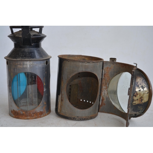 624 - Two vintage railway lamps to include a BR(M) railwayman's lamp with slatted red, green and blue glas... 