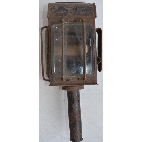 624 - Two vintage railway lamps to include a BR(M) railwayman's lamp with slatted red, green and blue glas... 