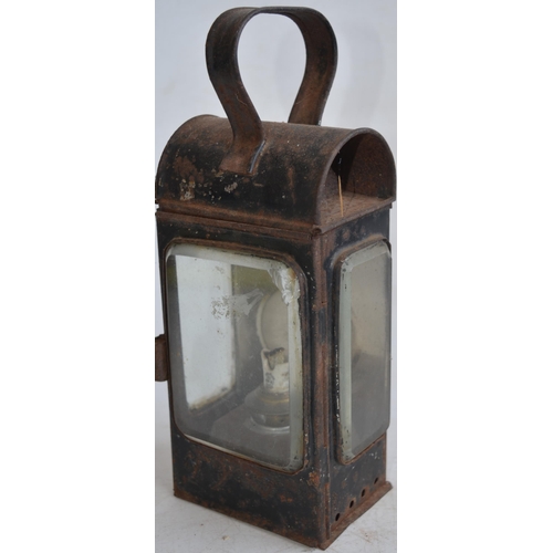 624 - Two vintage railway lamps to include a BR(M) railwayman's lamp with slatted red, green and blue glas... 