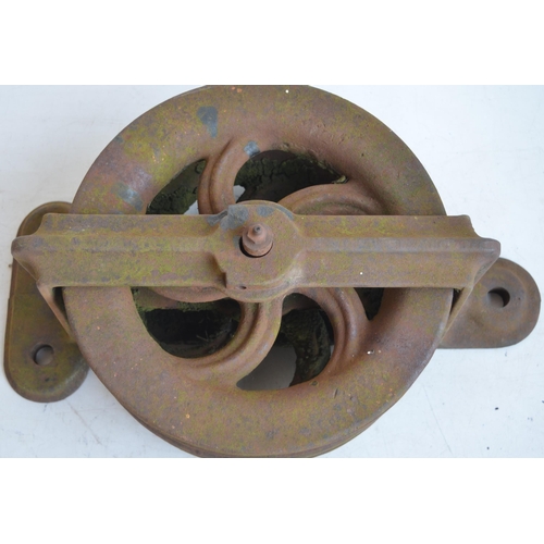 627 - Heavy cast iron double pulley, marked BD.