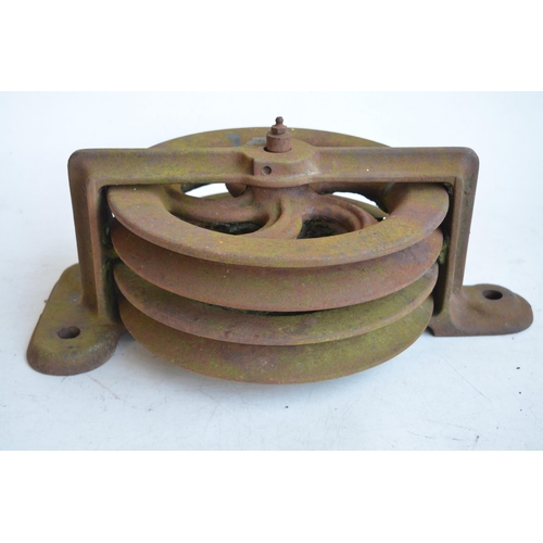 627 - Heavy cast iron double pulley, marked BD.