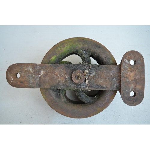 627 - Heavy cast iron double pulley, marked BD.