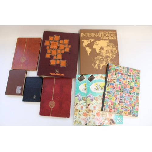 311 - Selection of all world stamp albums and folders of commem and defin, majority used (qty)