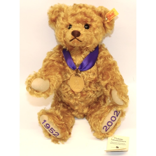 134 - Steiff teddy bear: Golden Jubilee (1952-2002) 660740, golden mohair, with purple ribbon and medallio... 