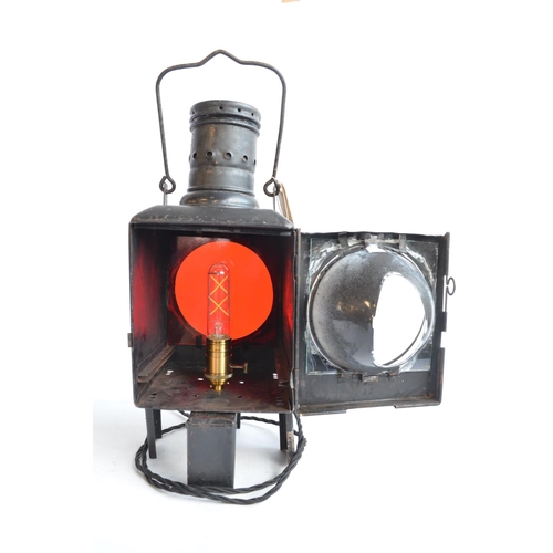 615 - An attractive vintage German Caboose lantern with fitted modern mains powered lighting. Height appro... 