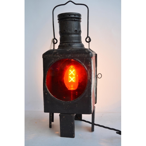 615 - An attractive vintage German Caboose lantern with fitted modern mains powered lighting. Height appro... 