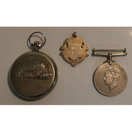 21 - War Medal 1939-45, silver watch fob, and a Sekonda pocket watch made in USSR, (3)