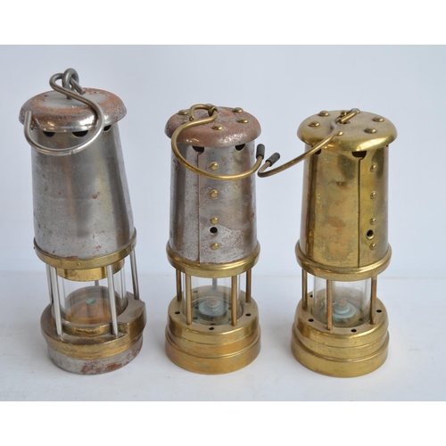 629 - Three vintage miners safety lamps to include one by British Coal Mining Company, Wales (from Aberama... 