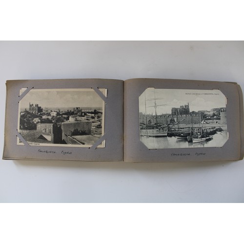 332 - c1920s postcard album showing postcards, photos and RPPCs from a Royal Navy telegraphists world tour... 