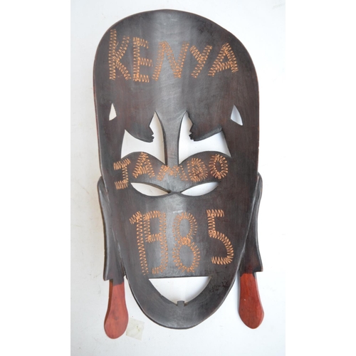 48 - African carved wooden mask and other similar items, a giant Canary Islands cigar, 2 reproduction pis... 