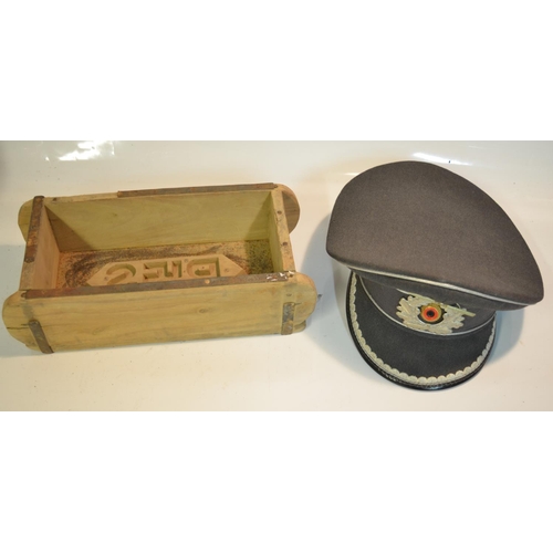 255 - Post war German military cap by Carl Jsken and dated 1969 with added NSDAP badge and a wartime Germa... 