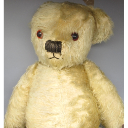 128 - Large Mid 1930's teddy bear in blonde mohair, possibly Merrythought, with repairs to pads, eyes and ... 