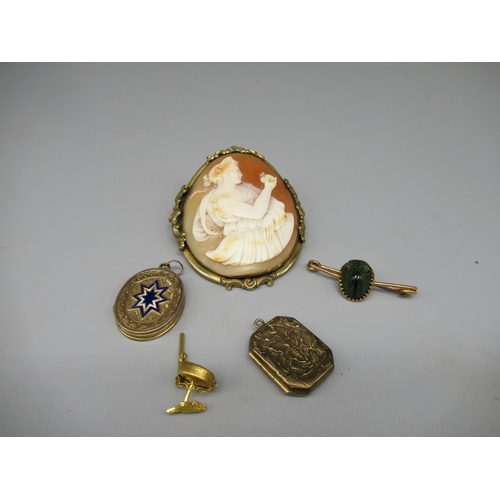 188 - Two yellow metal Edwardian locket pendants, and a yellow metal mounted cameo brooch, scarab pin and ... 