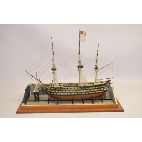 89 - Built up plastic kit (likely 1/180 scale Airfix) of HMS Victory in dry dock with diorama setting com... 