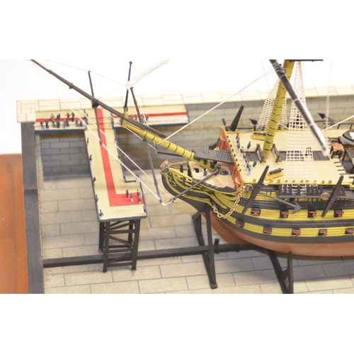 89 - Built up plastic kit (likely 1/180 scale Airfix) of HMS Victory in dry dock with diorama setting com... 