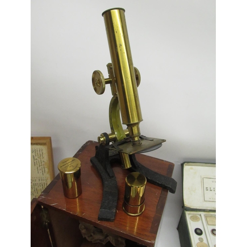 220 - J.T.Slugg of Manchester brass microscope with original wood case and a large collection of late 19th... 