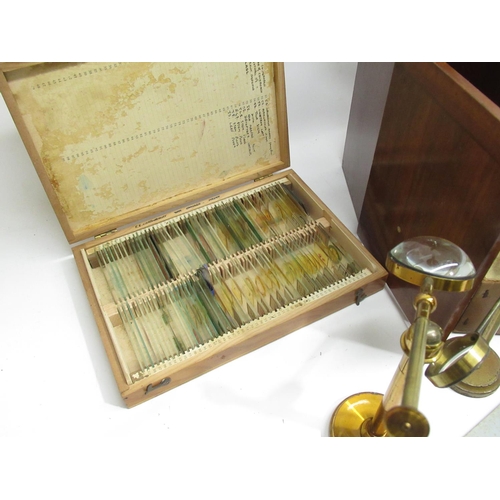 220 - J.T.Slugg of Manchester brass microscope with original wood case and a large collection of late 19th... 