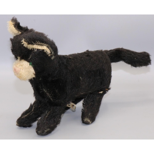 129 - Mid C20th clockwork jumping cat, black and white mohair, H17cm, with tag 'Made in Republic of Irelan... 