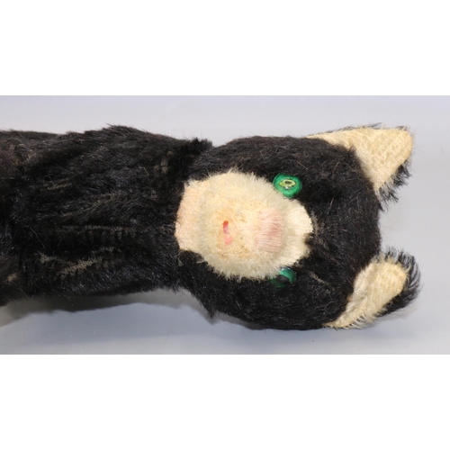 129 - Mid C20th clockwork jumping cat, black and white mohair, H17cm, with tag 'Made in Republic of Irelan... 