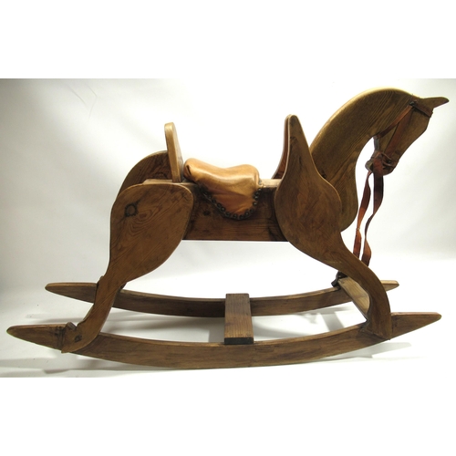 114 - Wooden rocking horse with tan leather seat