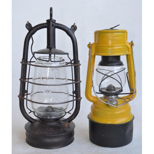 648 - Two vintage German paraffin storm lamps to include a Bat lamp (metal body stamped Made In Thuringia,... 