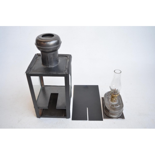 649 - World War II British blackout oil lantern (missing sloped side light inhibitor panels), a similarly ... 