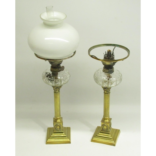161 - Pair of Late 19th/Early 20th century brass column oil lamps, 1 missing flume and globe