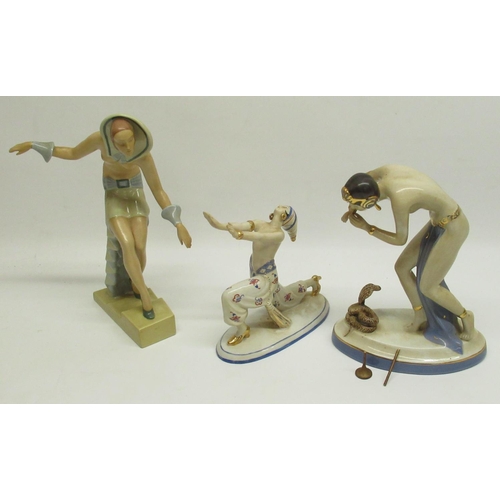 69 - Royal Dux model of an erotic female snake charmer (flute a/f but still present), H21cm and 2 other A... 