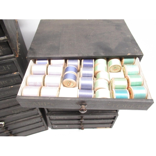 252 - Seven early C20th Carp's 'Touch'  three drawer material covered wood cotton reel chests, some retain... 