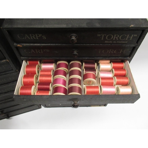 252 - Seven early C20th Carp's 'Touch'  three drawer material covered wood cotton reel chests, some retain... 