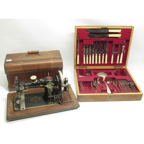 258 - G. H. Lee, Liverpool - C20th japanned walnut cased hand operated sewing machine, no. 442139, H32cm a... 