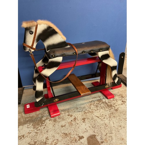 186 - Child's hand made dapple painted rocking horse, metal swing action on open work base, W96cm H68cm