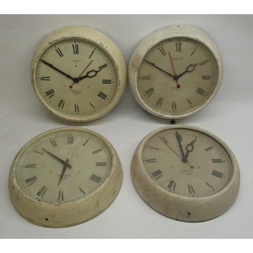 287 - Four Smiths Sectric electric wall clocks retailed by Eastern Watch, Bombay in painted metal cases D3... 