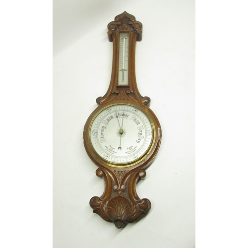 292 - Early C20th carved oak aneroid wheel barometer with thermometer box H82cm