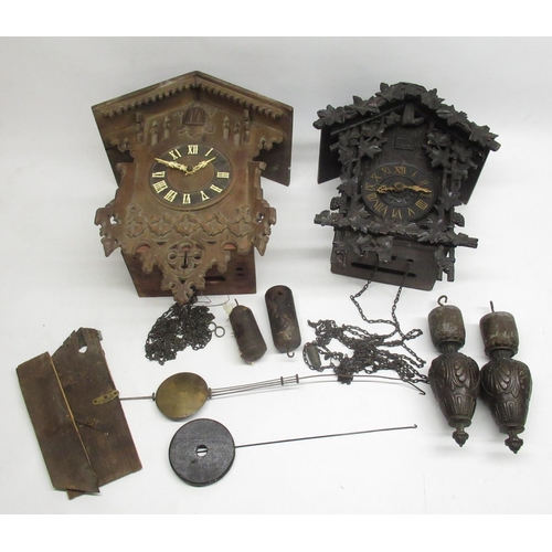 293 - Early C20th Black Forest cuckoo clock with applied rustic carved decoration and weight driven moveme... 