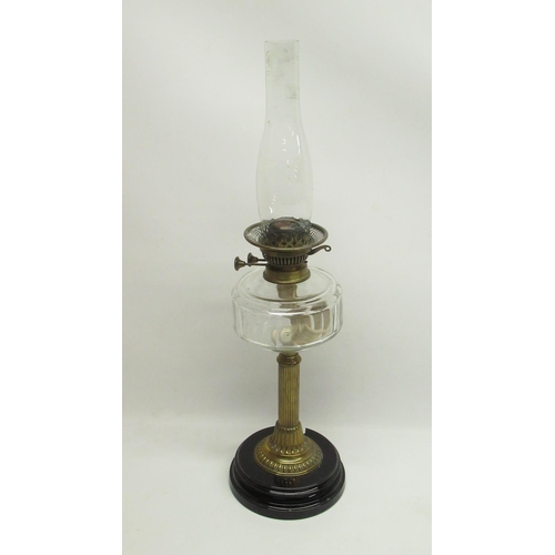 326 - National Lamp Works - late C19th paraffin lamp with faceted clear reservoir on fluted column H66cm